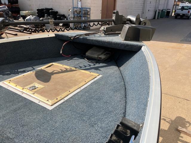1992 Starcraft FM 160C boat interior with carpeted deck and trolling motor.