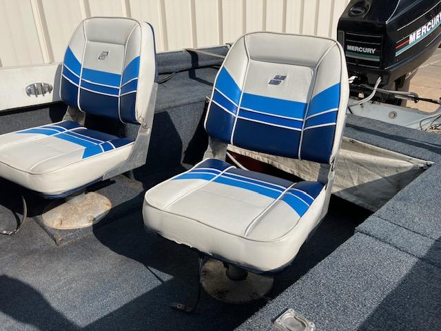 1992 Starcraft FM 160C boat seats with blue and white upholstery, Mercury motor visible.