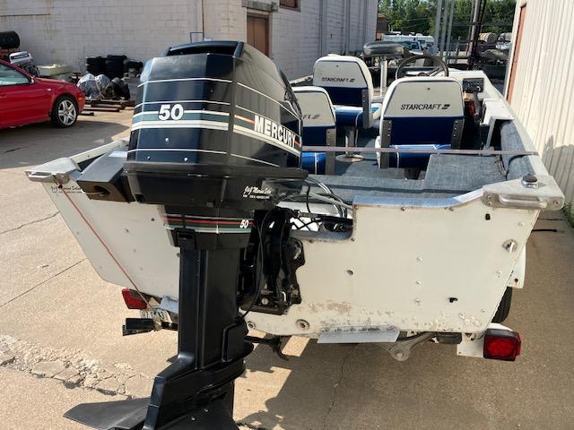 1992 Starcraft FM 160C boat with Mercury 50 outboard motor, parked outdoors.