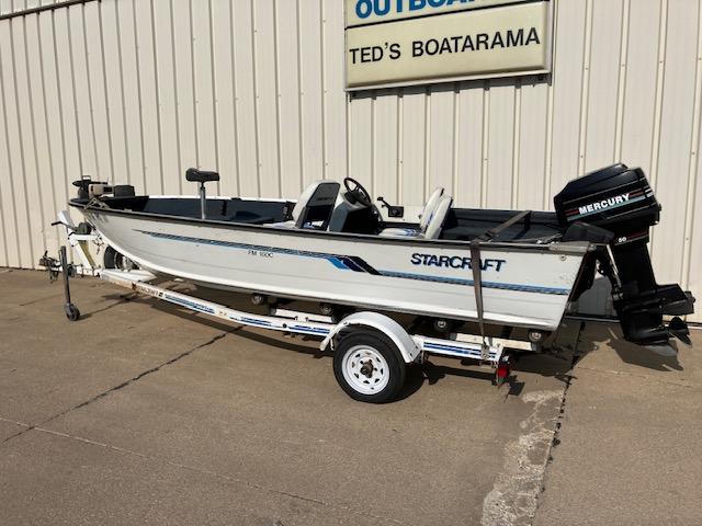 1992 Starcraft FM 160C boat on trailer, parked outside Ted's Boatarama.