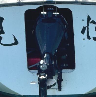 1979 Lancer Sloop boat with outboard motor, featuring distinctive black and white design.