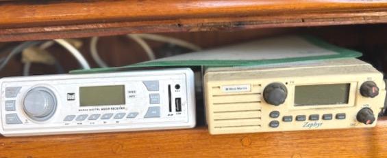 Vintage marine radios on a 1979 Lancer Sloop, featuring digital and analog controls.