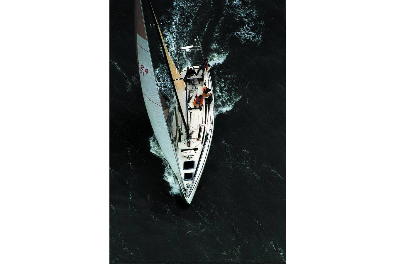 Aerial view of 1982 Santa Cruz 50 sailboat navigating through dark waters.