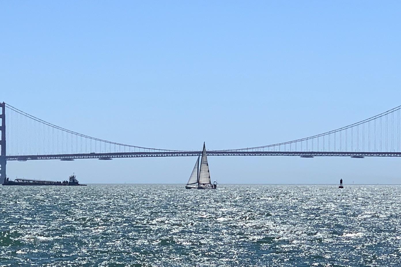 Sailboat near Golden Gate Bridge on sunny day, Santa Cruz 50, 1982 model.