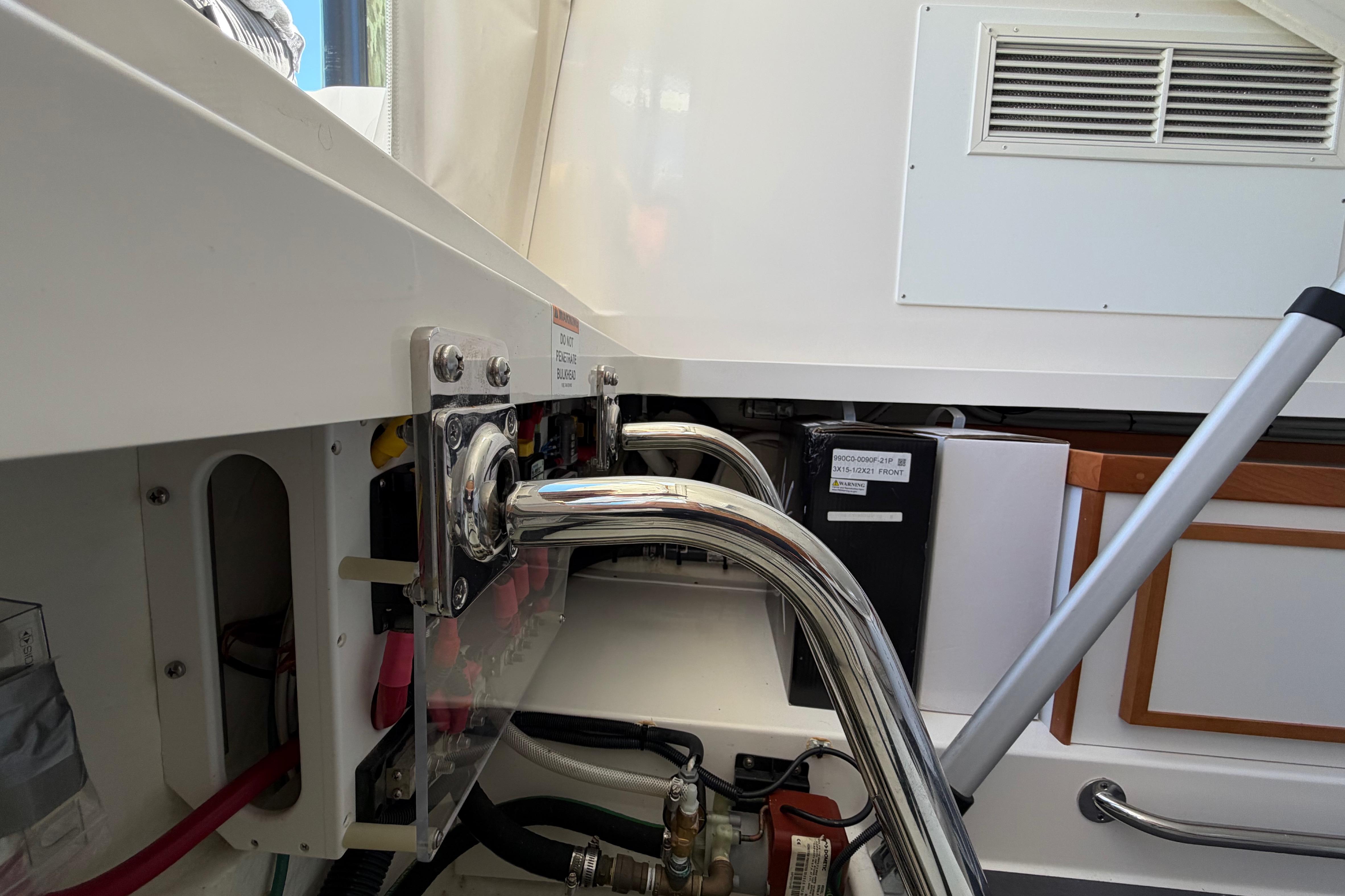 2023 Back Cove 340 boat interior showing engine compartment and metal fittings.