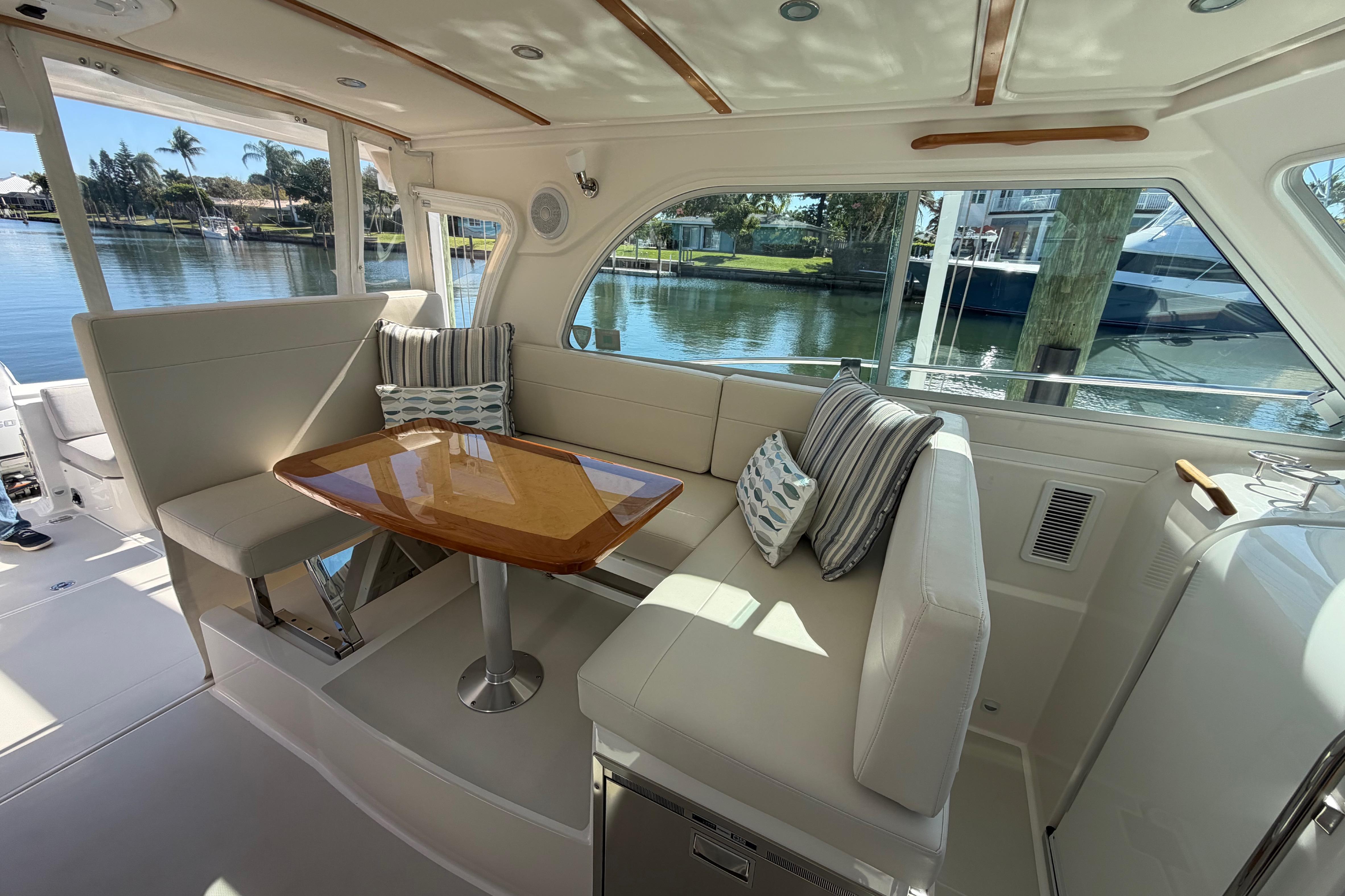 2023 Back Cove 340 yacht interior with elegant seating and waterfront view.