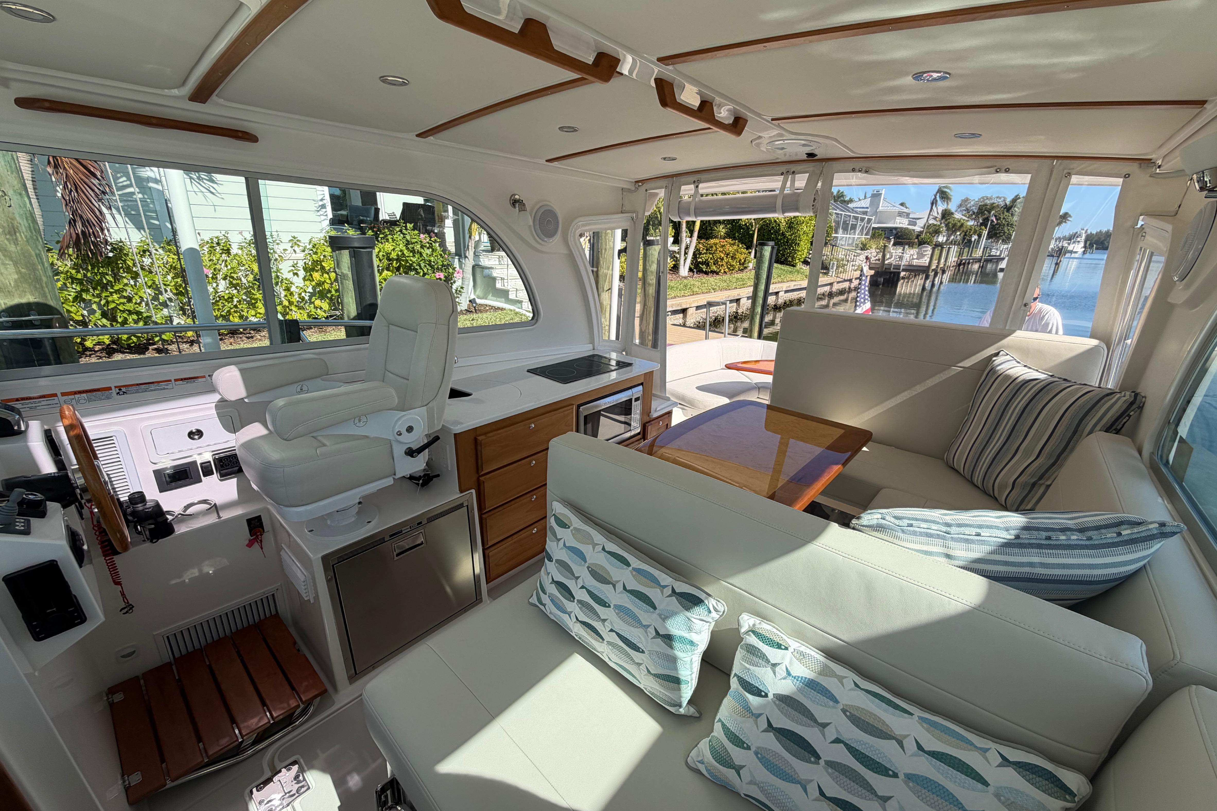 Luxurious interior of 2023 Back Cove 340 yacht with plush seating and elegant design.