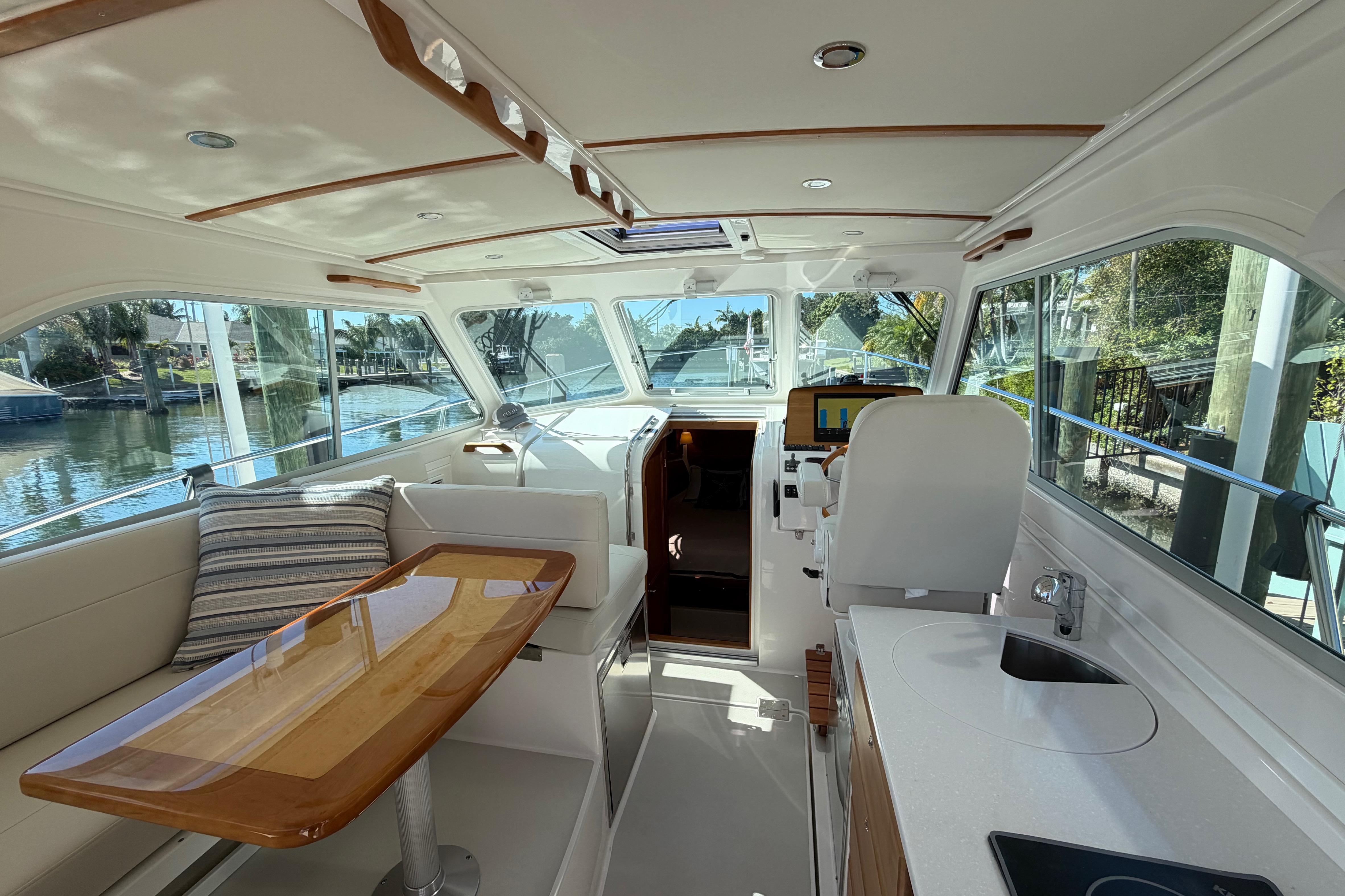Interior of 2023 Back Cove 340 yacht, featuring elegant seating and modern amenities.