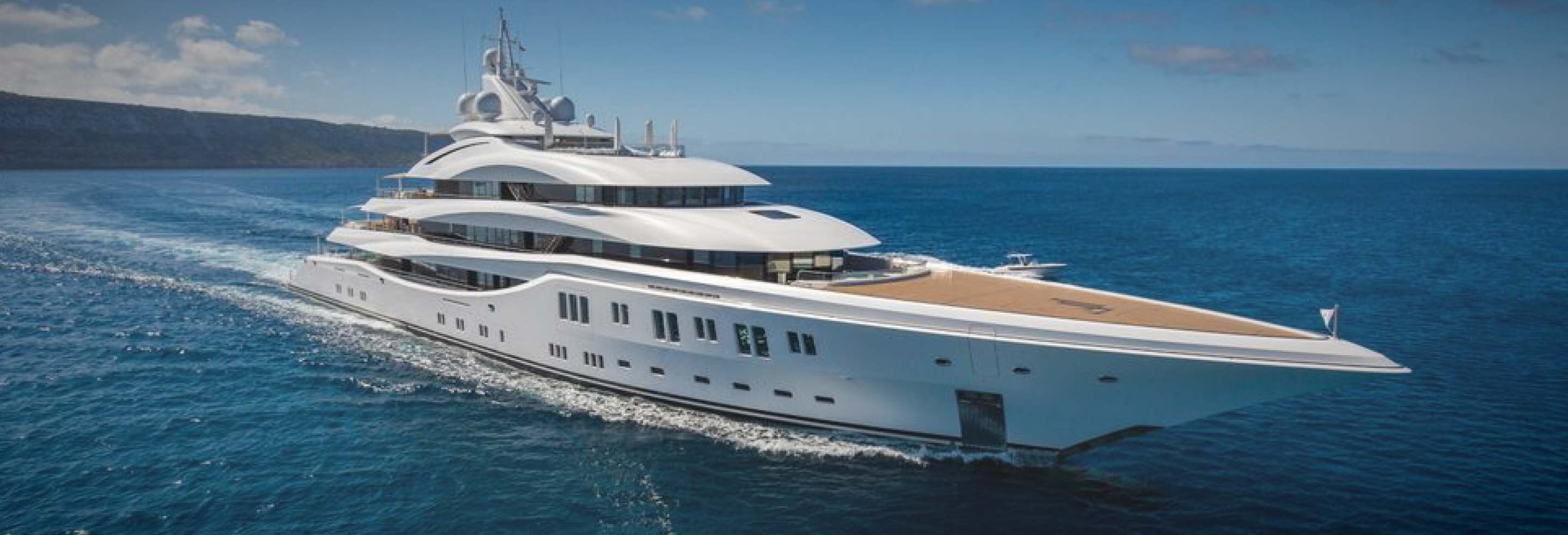 Luxury yacht sailing in deep water.
