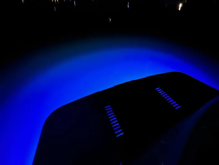 Seven Yacht Photos Pics Underwater lights illuminating the stern of a 2018 Princess V58 yacht at night.