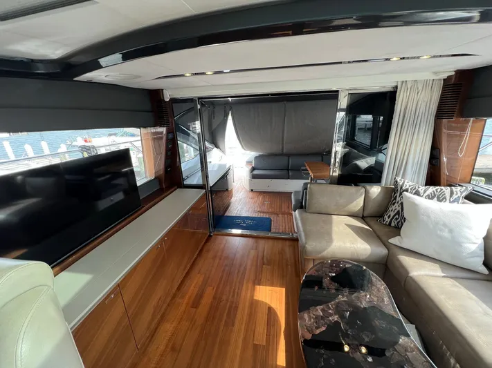 Seven Yacht Photos Pics Luxurious interior of 2018 Princess V58 yacht with modern furnishings and sleek design.