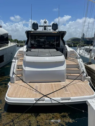 Seven Yacht Photos Pics 2018 Princess V58 yacht docked, showcasing sleek design and spacious deck.