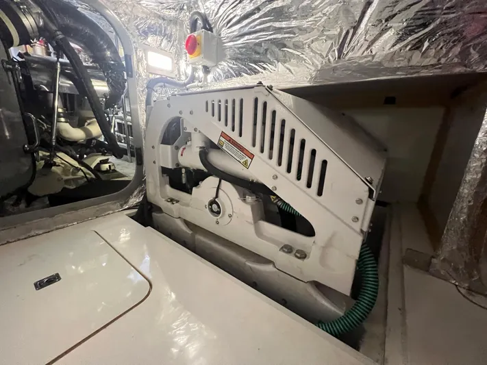Seven Yacht Photos Pics Engine room of 2018 Princess V58 yacht with mechanical components and insulation.
