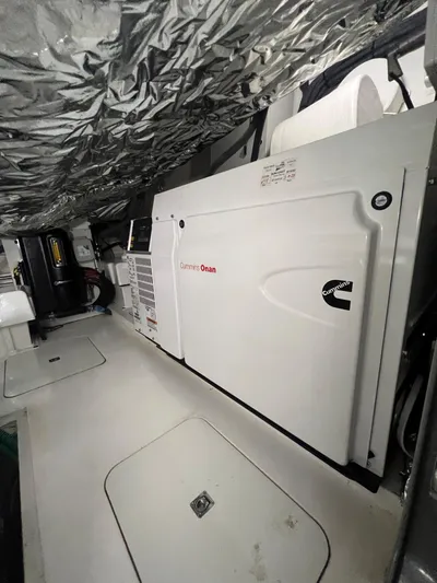 Seven Yacht Photos Pics Engine room of 2018 Princess V58 yacht with Cummins Onan generator.