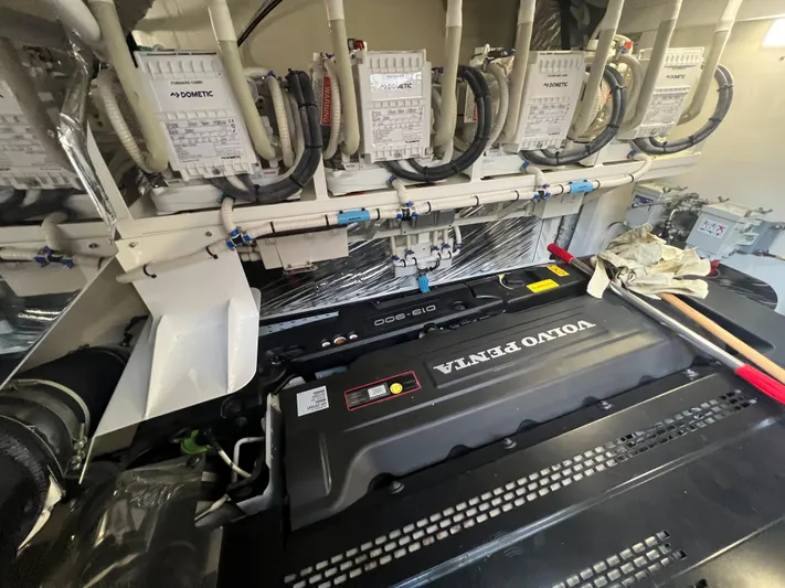 Seven Yacht Photos Pics Engine room of 2018 Princess V58 yacht featuring Volvo Penta engine components.