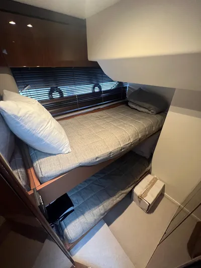 Seven Yacht Photos Pics Cozy bunk beds in 2018 Princess V58 yacht cabin with modern decor.