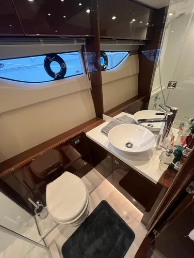 Seven Yacht Photos Pics Luxurious bathroom in 2018 Princess V58 yacht with modern fixtures and elegant design.