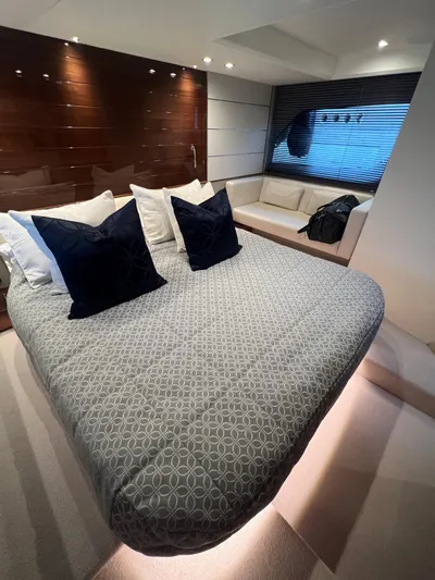 Seven Yacht Photos Pics Luxurious bedroom interior of 2018 Princess V58 yacht with modern decor and ambient lighting.