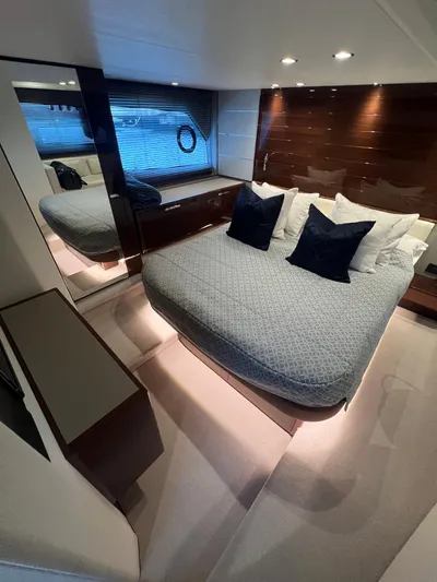 Seven Yacht Photos Pics Luxurious bedroom interior of 2018 Princess V58 yacht with modern design and elegant bedding.