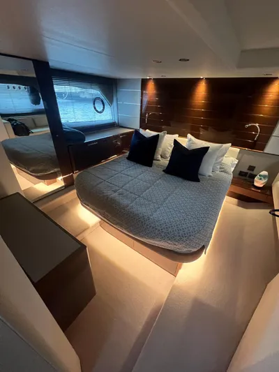 Seven Yacht Photos Pics Luxurious 2018 Princess V58 yacht bedroom with modern design and ambient lighting.