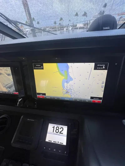 Seven Yacht Photos Pics Navigation system on 2018 Princess V58 yacht displaying nautical charts and speed.