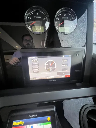 Seven Yacht Photos Pics Dashboard of a 2018 Princess V58 yacht with digital and analog displays.