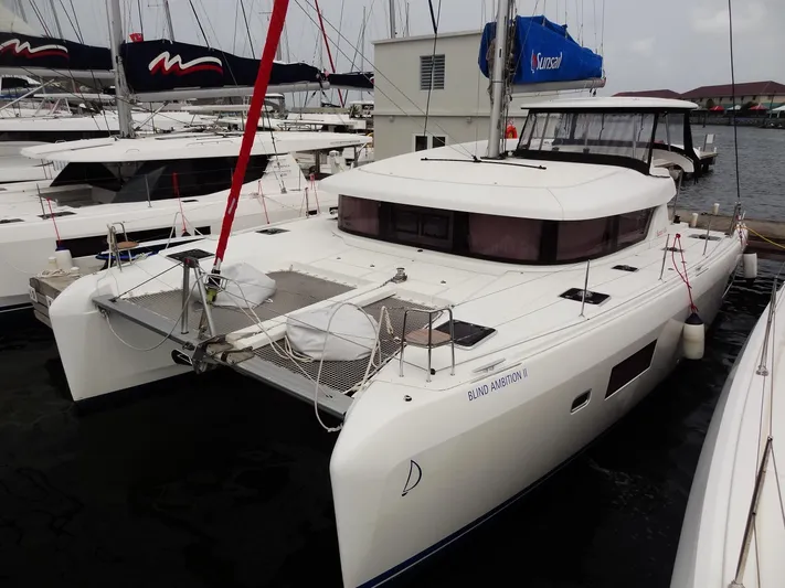 Blind Ambition II Yacht Photos Pics 2020 Lagoon 42 catamaran docked at marina, front view.