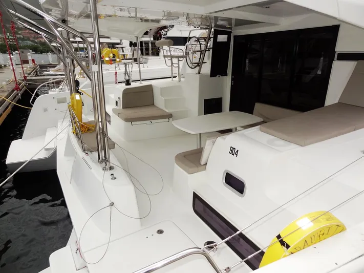 Blind Ambition II Yacht Photos Pics 2020 Lagoon 42 catamaran with spacious deck and seating area.