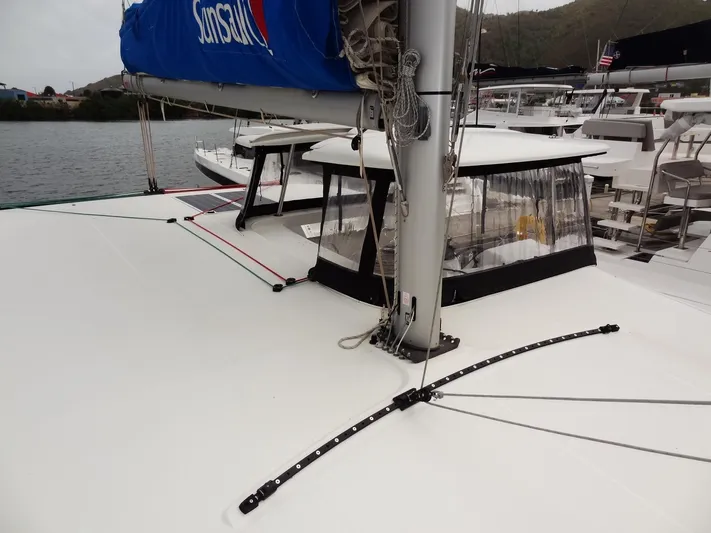 Blind Ambition II Yacht Photos Pics 2020 Lagoon 42 catamaran deck with mast and sail, docked in marina.