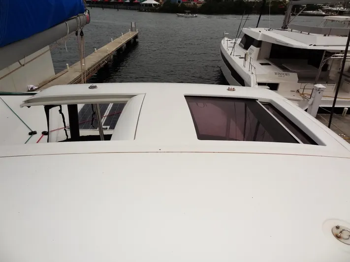 Blind Ambition II Yacht Photos Pics Lagoon 42 catamaran, 2020 model, docked at marina with open hatches.