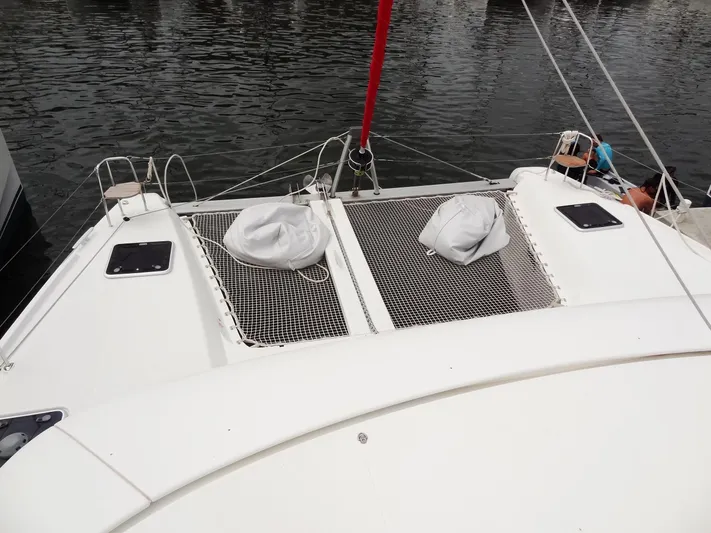 Blind Ambition II Yacht Photos Pics Lagoon 42 catamaran 2020 model, front deck with netting and water view.