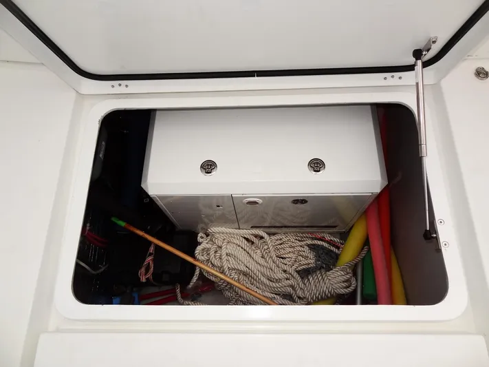 Blind Ambition II Yacht Photos Pics Storage compartment of a 2020 Lagoon 42 catamaran with ropes and equipment.