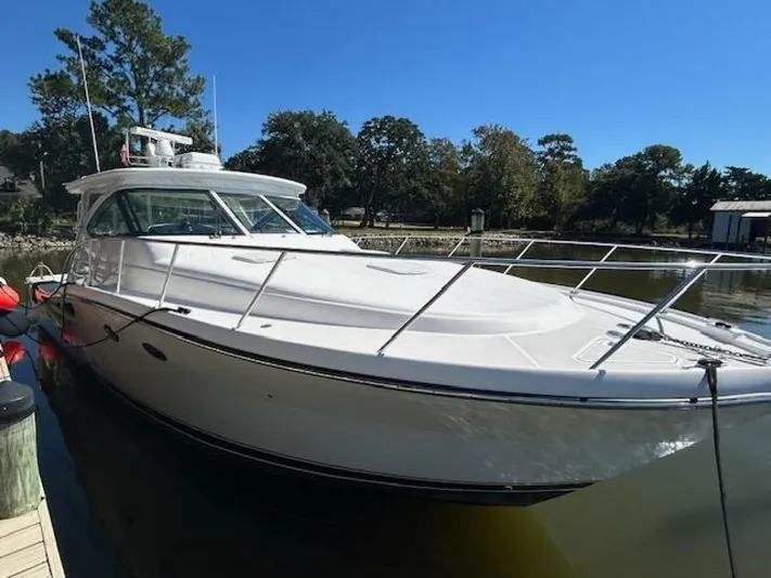 Absolutely Yacht Photos Pics 2006 Tiara Yachts Open docked, showcasing sleek design and spacious deck under clear blue sky.