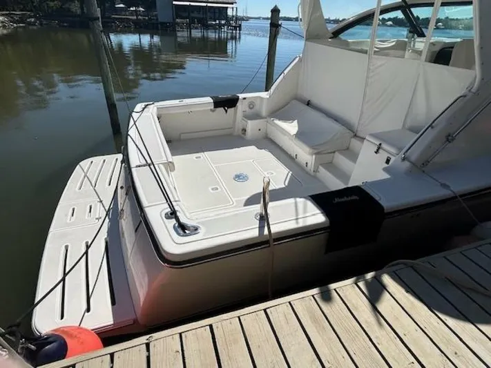 Absolutely Yacht Photos Pics 2006 Tiara Yachts Open docked, showcasing spacious deck and seating area.