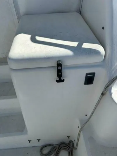Absolutely Yacht Photos Pics 2006 Tiara Yachts Open storage compartment with latch, white exterior.