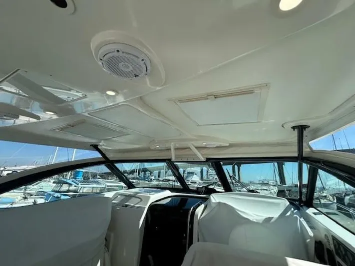 Absolutely Yacht Photos Pics 2006 Tiara Yachts Open interior with white seating and panoramic windows.