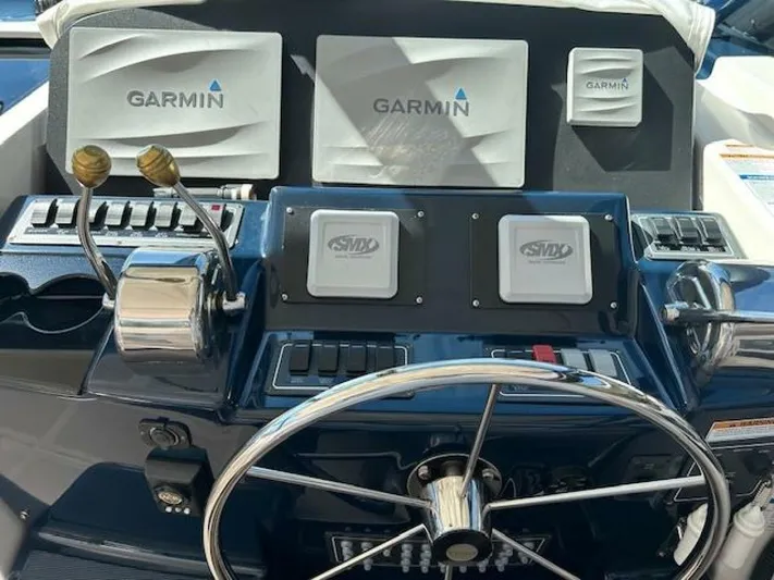 Absolutely Yacht Photos Pics Helm of 2006 Tiara Yachts Open with Garmin navigation systems and dual controls.