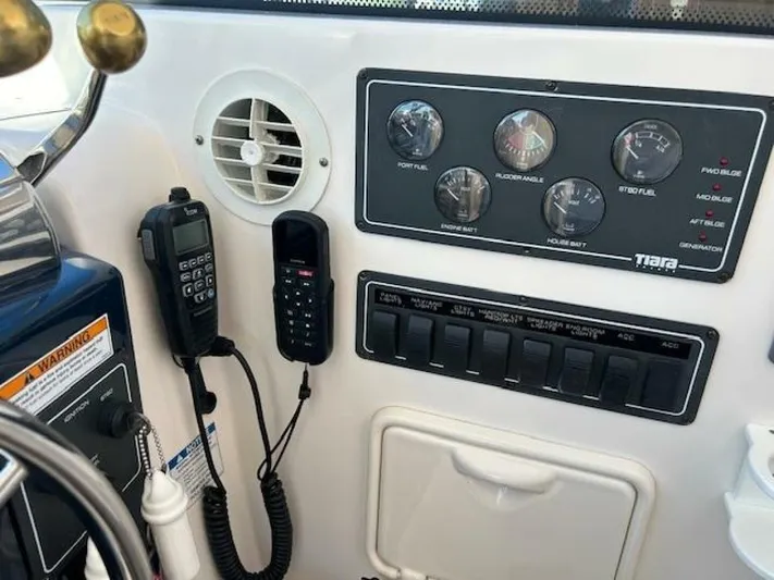 Absolutely Yacht Photos Pics 2006 Tiara Yachts Open dashboard with gauges, switches, and communication devices.