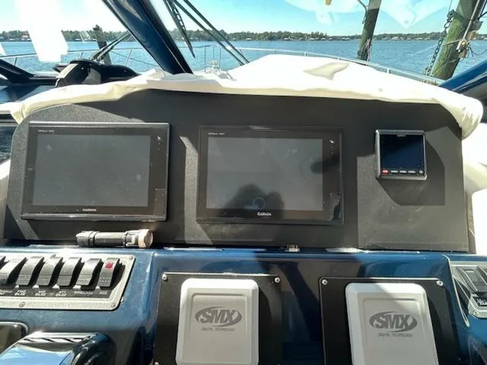 Absolutely Yacht Photos Pics Helm of 2006 Tiara Yachts Open with navigation screens and controls.