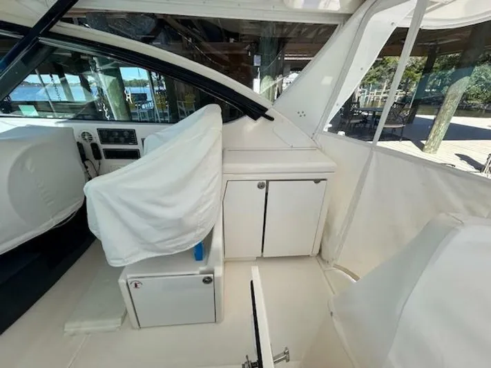 Absolutely Yacht Photos Pics 2006 Tiara Yachts Open interior with covered seats and storage cabinets.