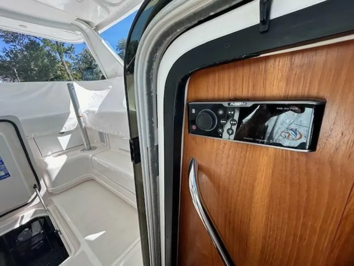 Absolutely Yacht Photos Pics 2006 Tiara Yachts Open interior with wood paneling and audio controls.