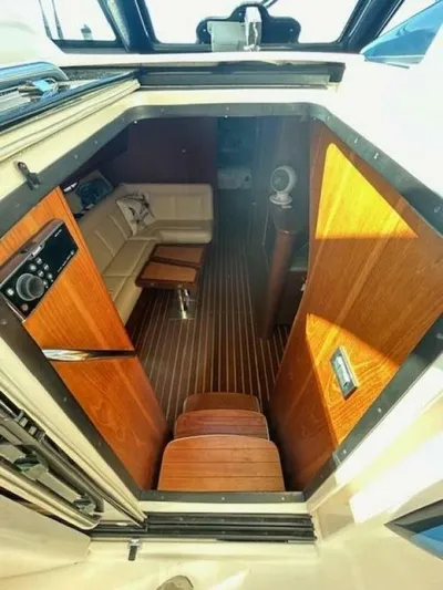 Absolutely Yacht Photos Pics 2006 Tiara Yachts Open interior with wooden steps and seating area.