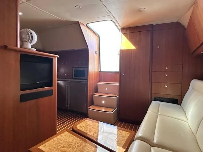Absolutely Yacht Photos Pics 2006 Tiara Yachts Open interior with wood finish, white seating, and modern amenities.
