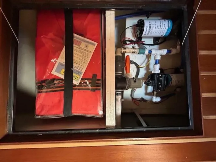 Absolutely Yacht Photos Pics 2006 Tiara Yachts Open storage compartment with equipment and red safety gear.