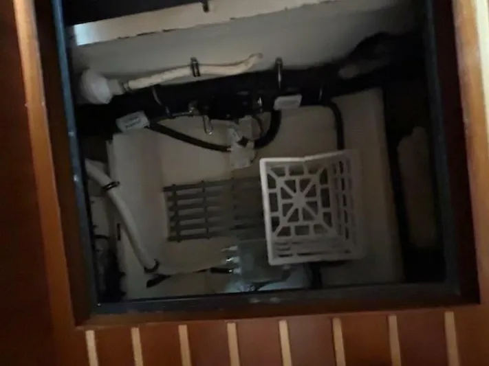 Absolutely Yacht Photos Pics 2006 Tiara Yachts Open interior compartment with visible pipes and storage area.