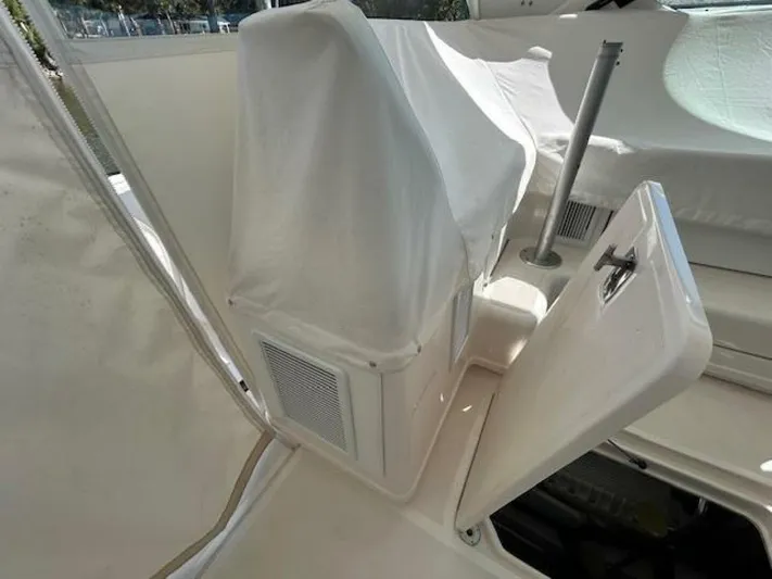 Absolutely Yacht Photos Pics 2006 Tiara Yachts Open interior with covered seating and storage compartment.