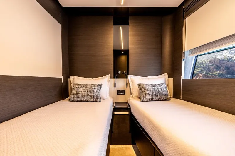  Yacht Photos Pics Luxurious twin cabin interior of 2023 Azimut S8 yacht with modern design and window view.