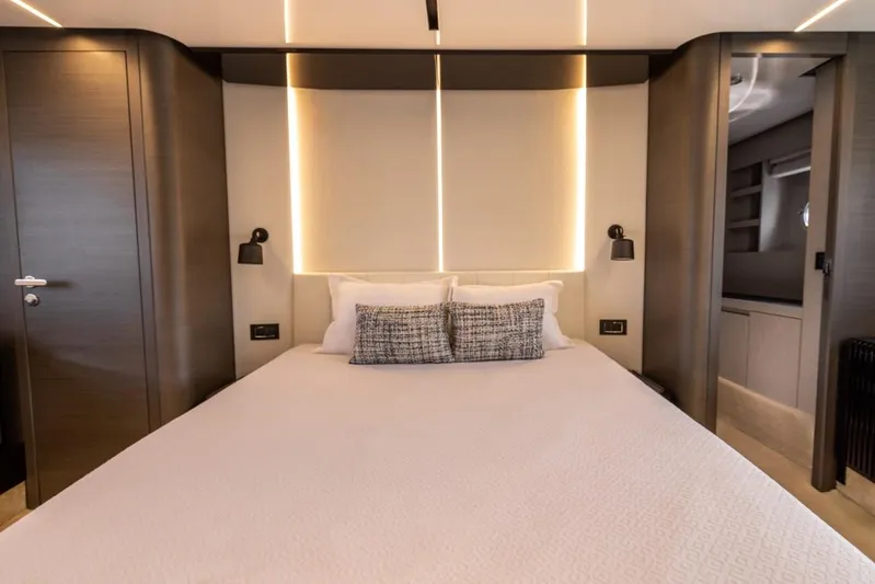  Yacht Photos Pics Luxurious bedroom interior of 2023 Azimut S8 yacht with modern design and ambient lighting.