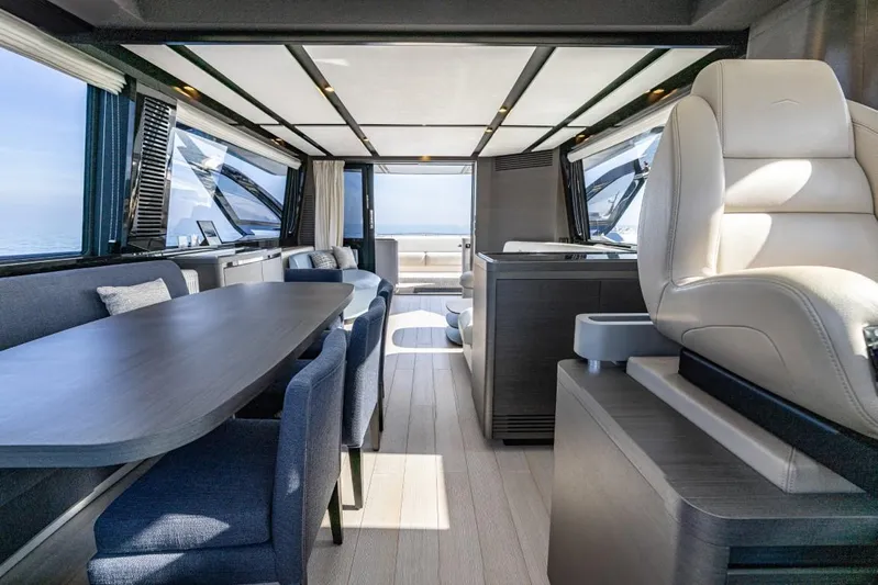  Yacht Photos Pics Luxurious interior of 2023 Azimut S8 yacht, featuring elegant seating and panoramic windows.
