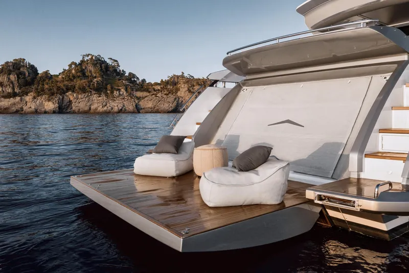  Yacht Photos Pics Luxury Azimut S8 yacht deck with plush seating, 2023 model, scenic coastal backdrop.